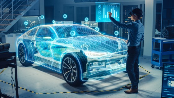 Person using AR with IoT industrial solutions for EV manufacturing design